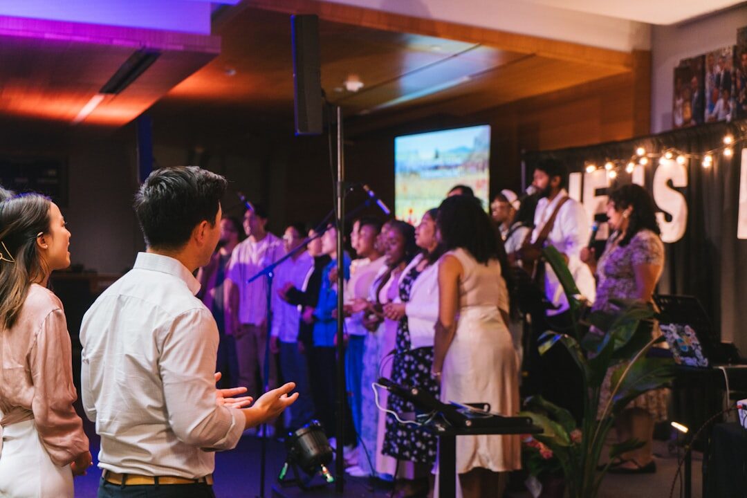 Diverse group of professionals networking at an evening business event